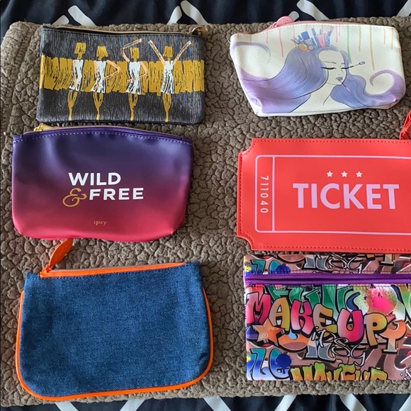 ipsy Handbags - 14 small bags all different colors for sale